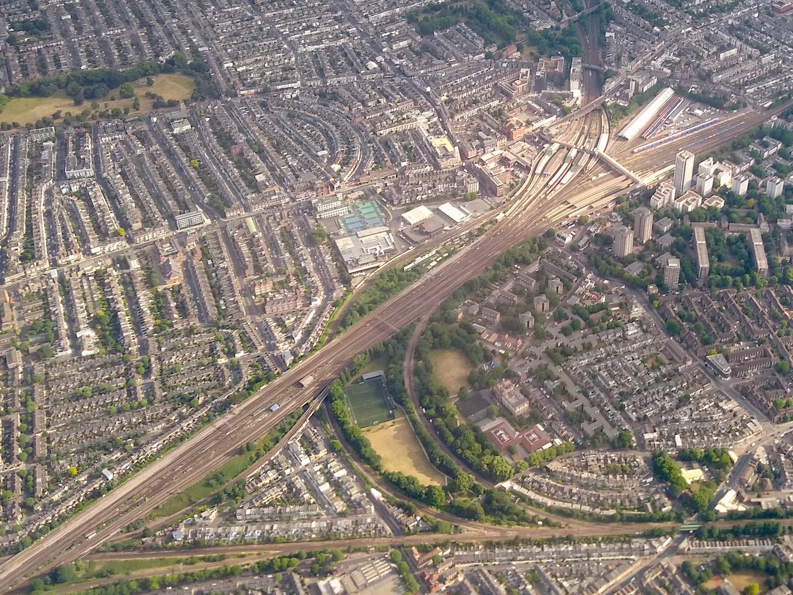 Aerial view of Clapham Junction railway station, where dozens of tracks converge, branch, and merge through the same shared crossings.